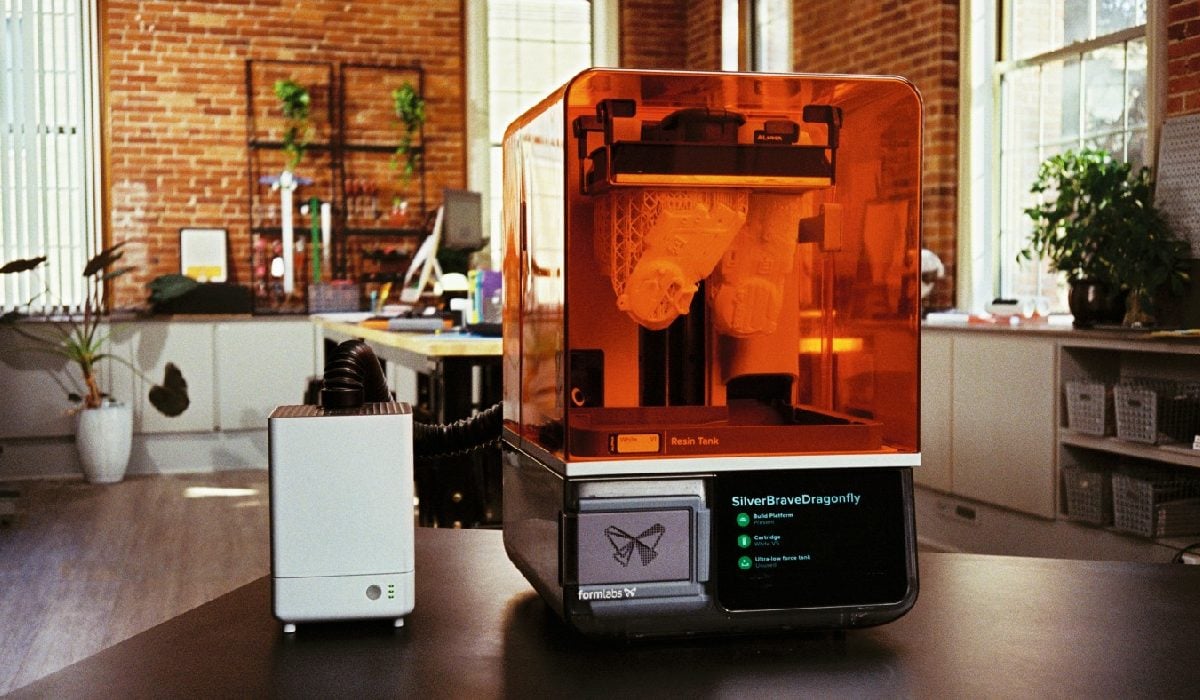Formlabs VOC Extractor Filtration System next to a Formlabs photopolymer 3D printer during SLA printing