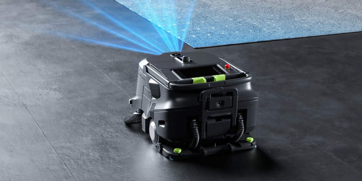Floor cleaning robot projects a blue navigation light pattern on a tiled floor