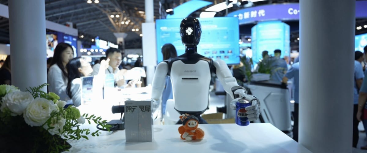 Humanoid robot AgiBot with robotic hand OmniHand 3 Ultra-M holding an object